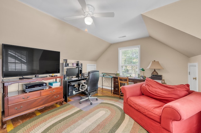 home office with lofted ceiling, hardwood / wood-style floors, and ceiling fan