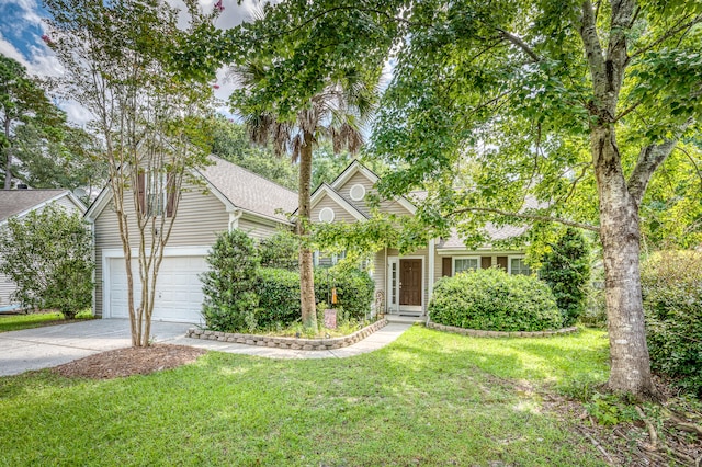 view of front facade with a front yard and a garage