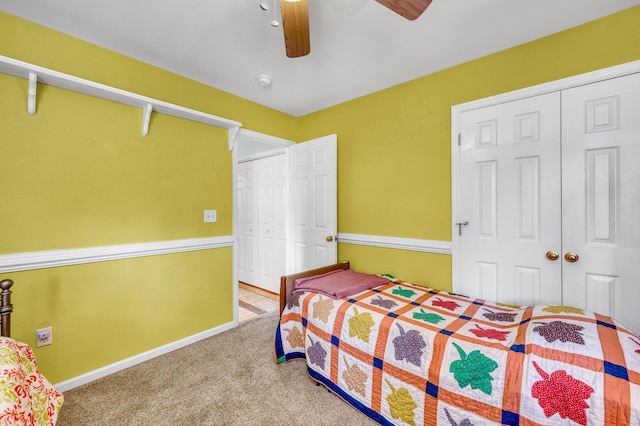 bedroom with carpet floors, a closet, a ceiling fan, and baseboards