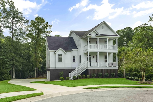 view of front of home featuring a front lawn and a balcony