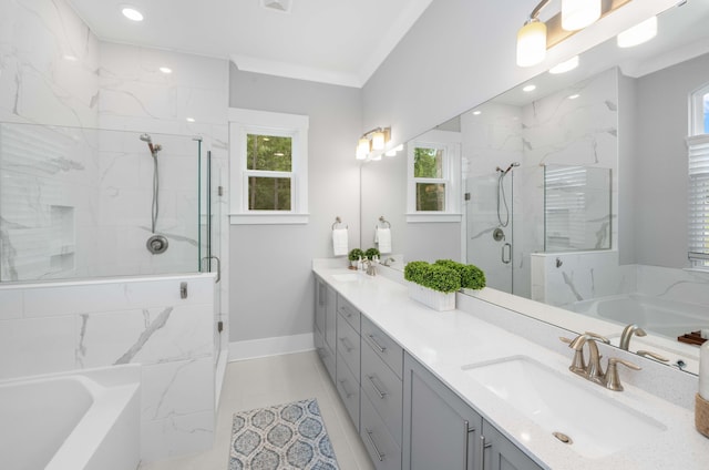 bathroom with crown molding, vanity, tile patterned floors, and separate shower and tub