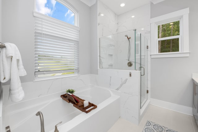 bathroom with vanity, tile patterned floors, and separate shower and tub