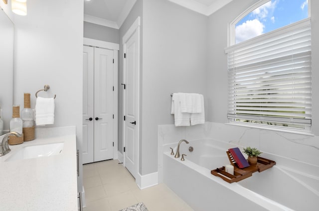 bathroom with tile patterned flooring, vanity, crown molding, and a bath