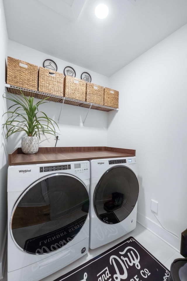 laundry room featuring washer and clothes dryer