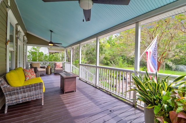 wooden terrace with outdoor lounge area and ceiling fan