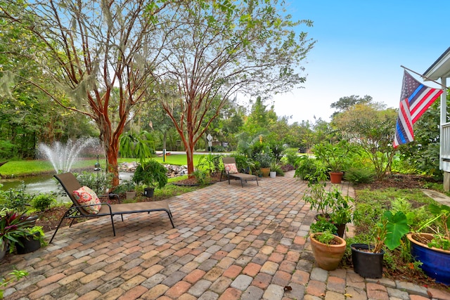 view of patio / terrace with a water view