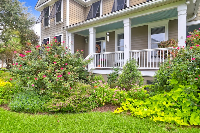 property entrance featuring covered porch