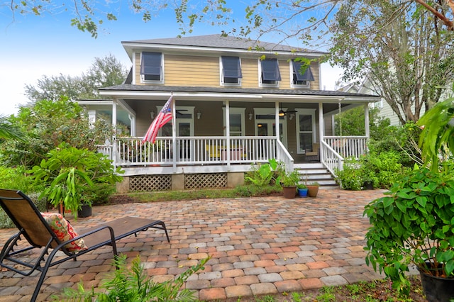 farmhouse inspired home featuring a patio and covered porch