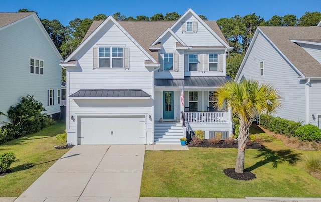 view of front of property with a garage, a front lawn, and covered porch