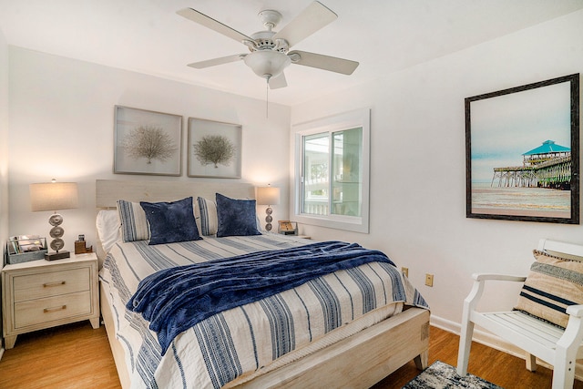 bedroom with ceiling fan and light hardwood / wood-style flooring