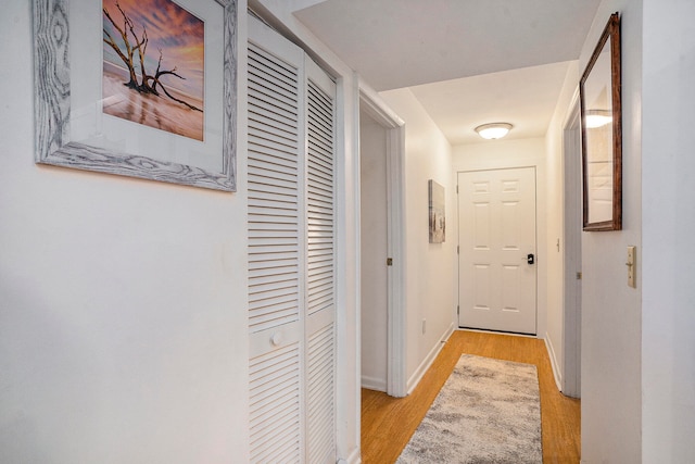 corridor featuring light hardwood / wood-style floors