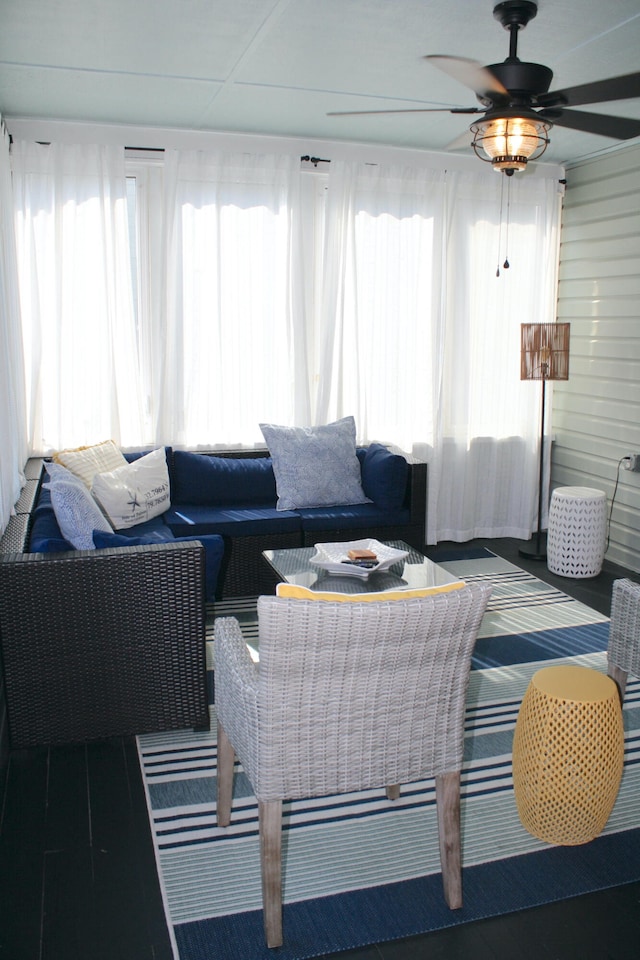 living room with ceiling fan and plenty of natural light