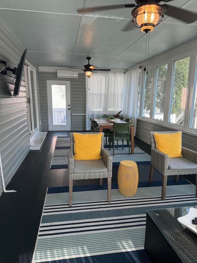 sunroom / solarium with ceiling fan