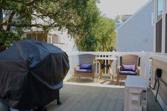 wooden deck featuring area for grilling