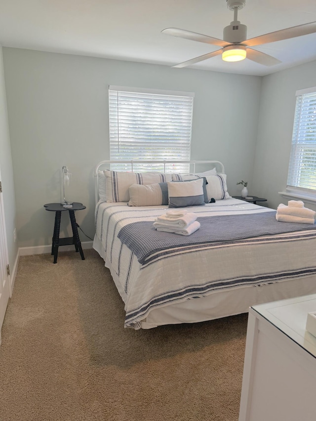32 41st Ave, Isle Of Palms, SC 29451 - bedroom with light carpet, ceiling fan, and baseboards