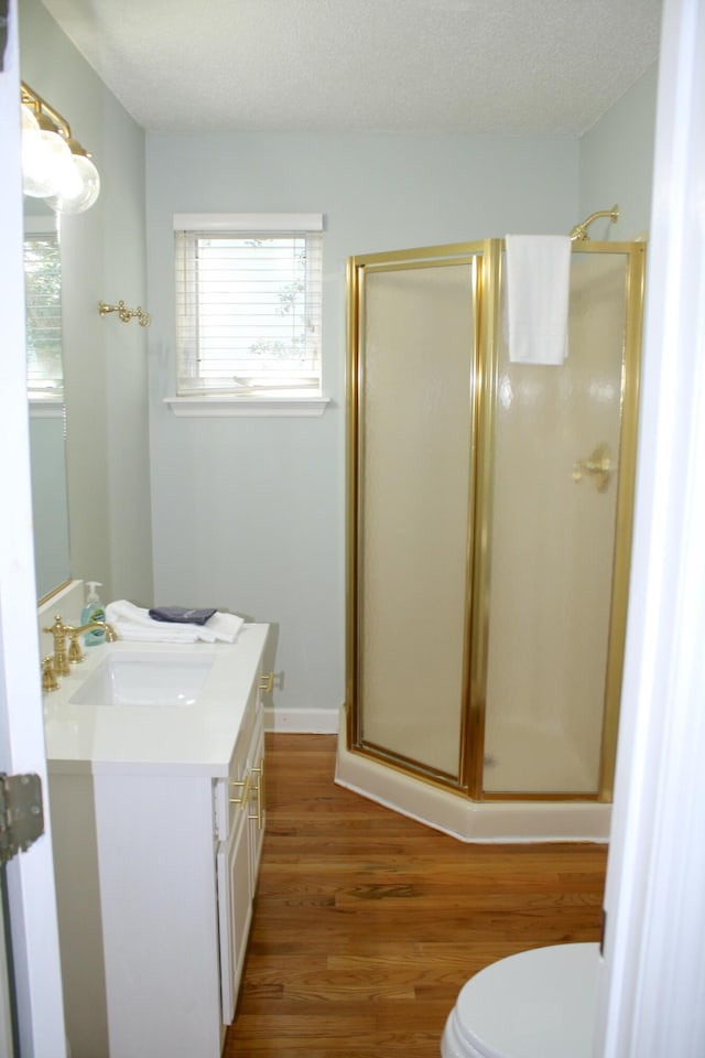 32 41st Ave, Isle Of Palms, SC 29451 - bathroom with a stall shower, wood finished floors, and vanity