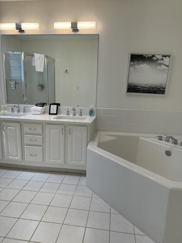 32 41st Ave, Isle Of Palms, SC 29451 - bathroom with tile patterned flooring, a stall shower, double vanity, and a garden tub