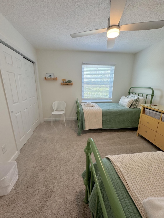 32 41st Ave, Isle Of Palms, SC 29451 - bedroom with a ceiling fan, carpet flooring, a closet, a textured ceiling, and baseboards