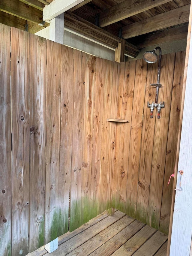 view of sauna with wooden walls