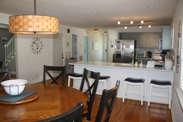 32 41st Ave, Isle Of Palms, SC 29451 - dining room with stairway and dark wood-type flooring