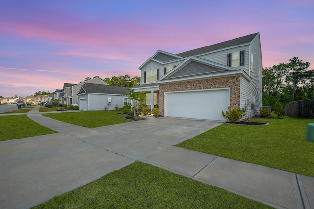 225 N Light Way, Summerville, SC 29486 - traditional-style house featuring concrete driveway, a front lawn, a garage, and brick siding