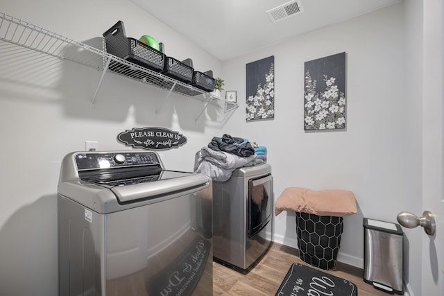 225 N Light Way, Summerville, SC 29486 - laundry area featuring washer and clothes dryer and light wood-style flooring