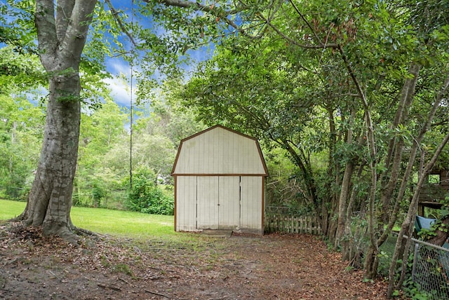 view of shed with fence