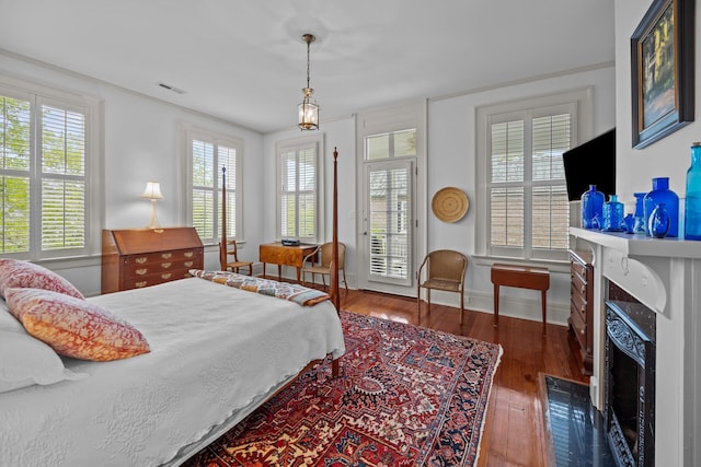 41 Legare St Unit C, Charleston, SC 29401 - bedroom featuring access to exterior, a high end fireplace, hardwood / wood-style flooring, baseboards, and multiple windows