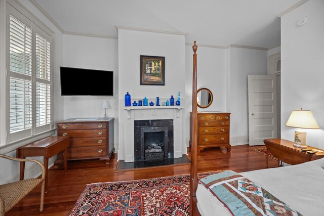 41 Legare St Unit C, Charleston, SC 29401 - bedroom featuring wood finished floors, crown molding, a premium fireplace, and baseboards