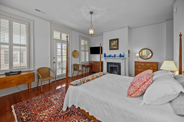 41 Legare St Unit C, Charleston, SC 29401 - bedroom featuring access to outside, wood finished floors, and a fireplace