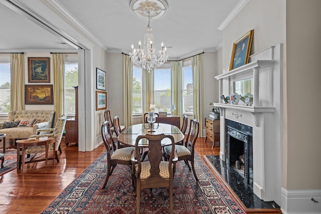 41 Legare St Unit C, Charleston, SC 29401 - dining area with crown molding, a chandelier, wood finished floors, a premium fireplace, and baseboards