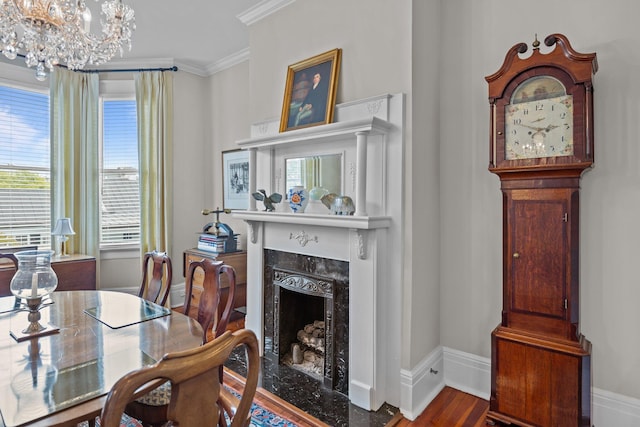 41 Legare St Unit C, Charleston, SC 29401 - dining space featuring a high end fireplace, a chandelier, ornamental molding, baseboards, and wood finished floors