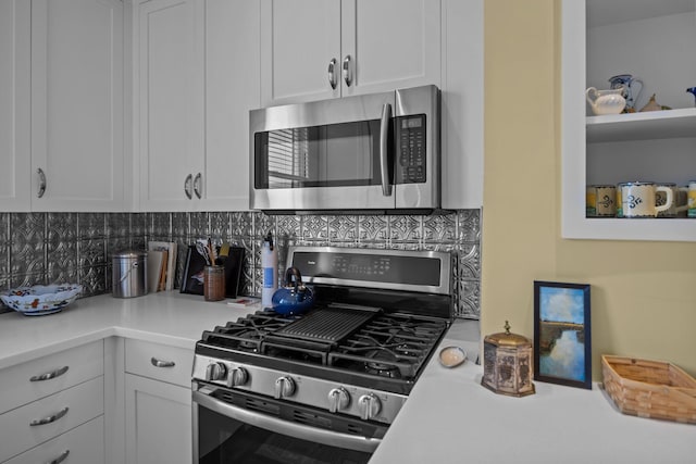 41 Legare St Unit C, Charleston, SC 29401 - kitchen with stainless steel appliances, white cabinetry, light countertops, and tasteful backsplash
