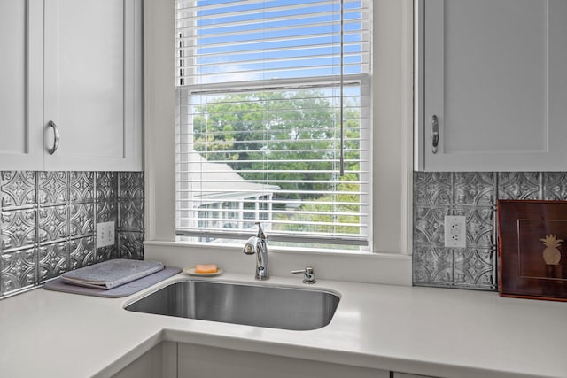 41 Legare St Unit C, Charleston, SC 29401 - kitchen featuring tasteful backsplash, light countertops, and a sink