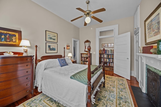 41 Legare St Unit C, Charleston, SC 29401 - bedroom featuring a fireplace, wood finished floors, and ceiling fan