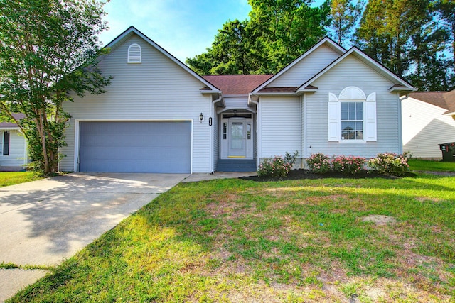 ranch-style house featuring a garage, driveway, a front lawn, and roof with shingles