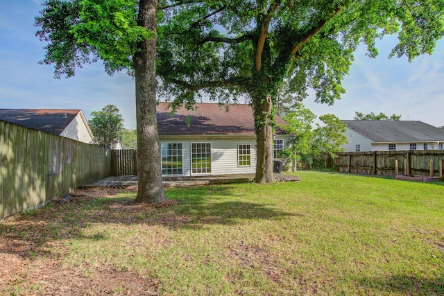 view of yard with a fenced backyard