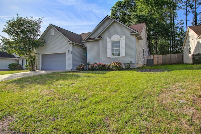 ranch-style home with a front lawn, central air condition unit, driveway, fence, and a garage