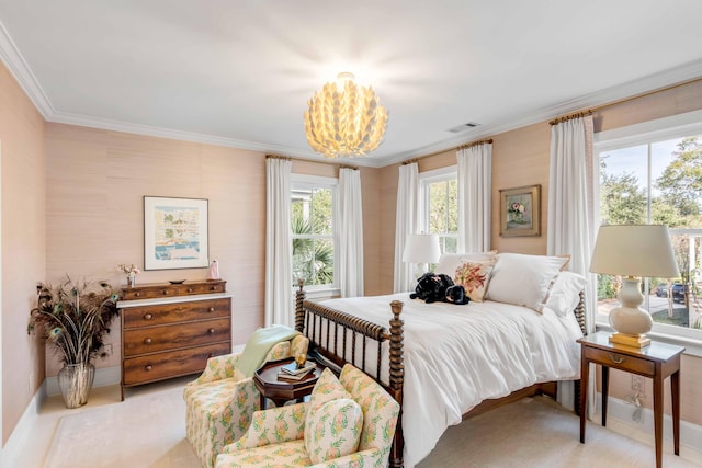 bedroom featuring crown molding and a chandelier