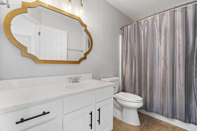 bathroom featuring vanity, curtained shower, tile patterned floors, and toilet