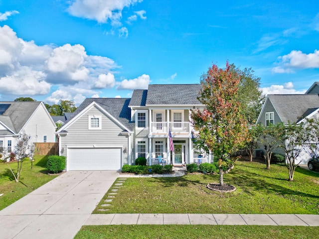 view of front of property featuring a garage, a porch, a front yard, and a balcony