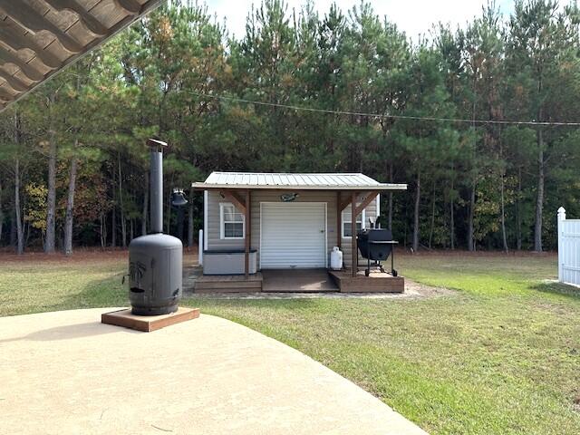 view of outbuilding with a lawn