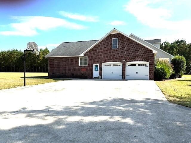 view of side of home featuring a yard