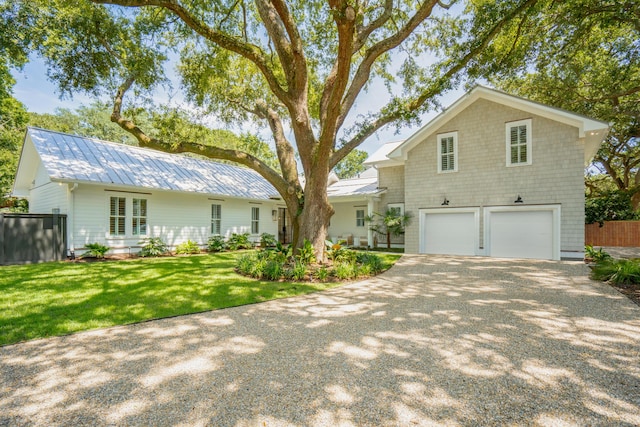 view of front facade with a garage and a front yard