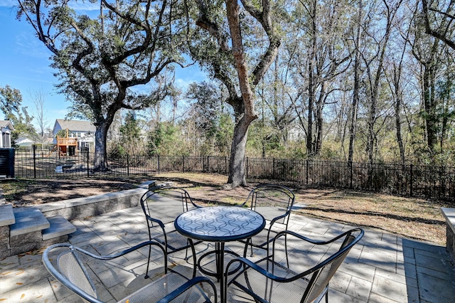 view of patio with outdoor dining space and a fenced backyard