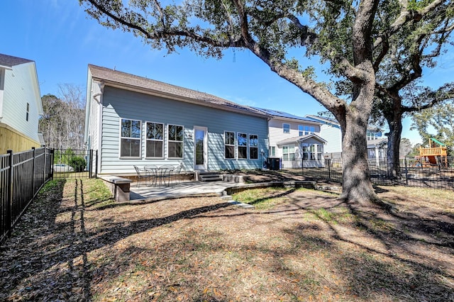 back of house with a patio, central AC unit, a fenced backyard, and entry steps