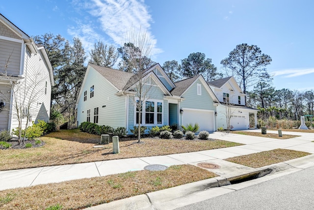 view of front of home with driveway and a garage