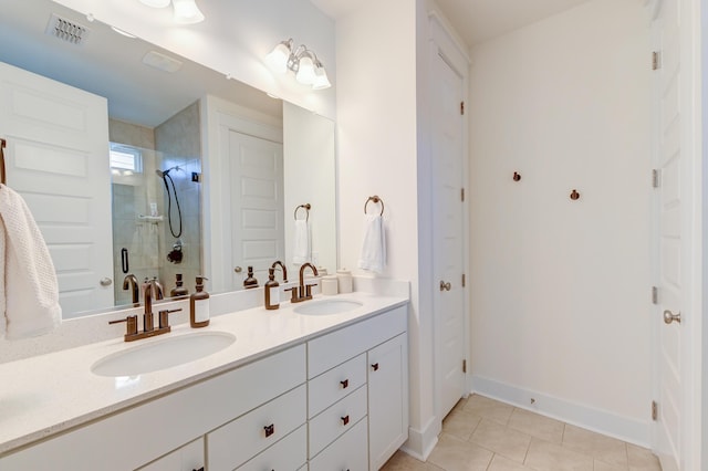 bathroom with a sink, visible vents, a stall shower, and double vanity