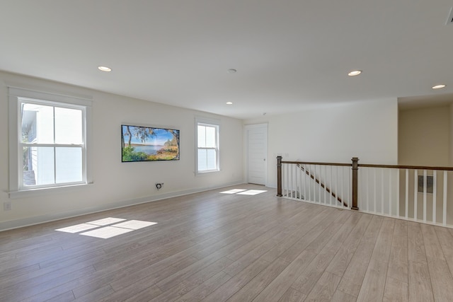 unfurnished room featuring recessed lighting and light wood-type flooring