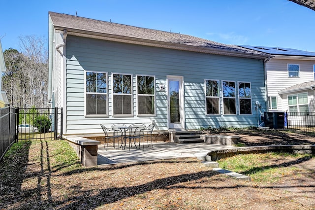 back of property with a patio, central AC, and fence